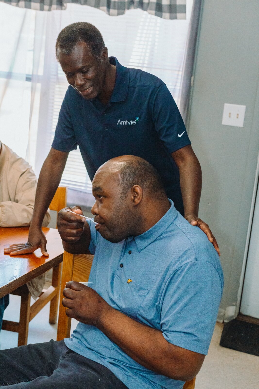 Amivie IDD support services — staff working with individual with intellectual disability