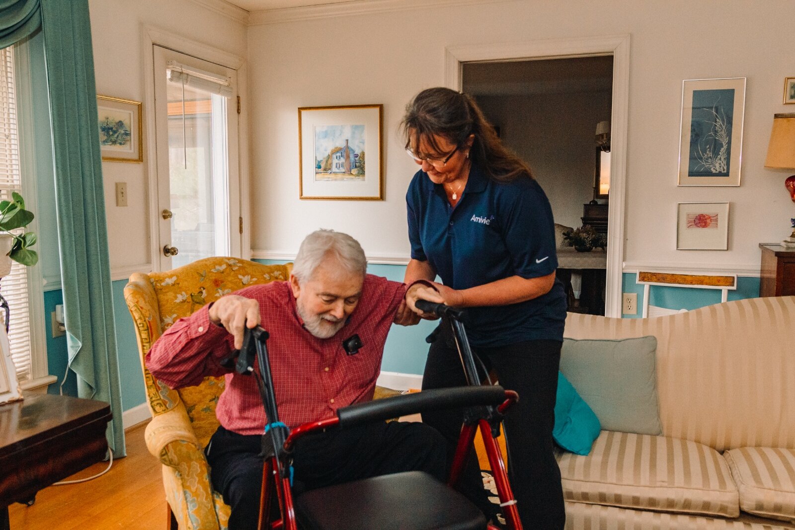 Amivie senior home care — caregiver assisting elderly resident